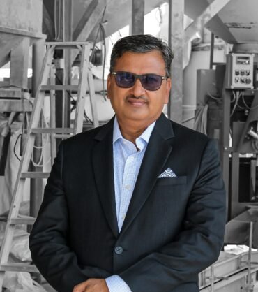 a man wearing sunglasses and a suit