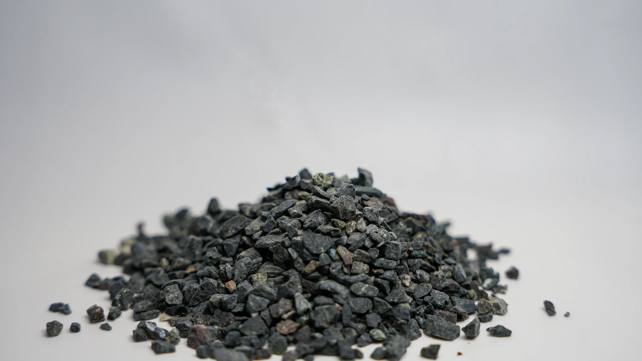 a pile of small black rocks