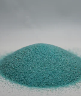 A small mound of fine sky blue sand