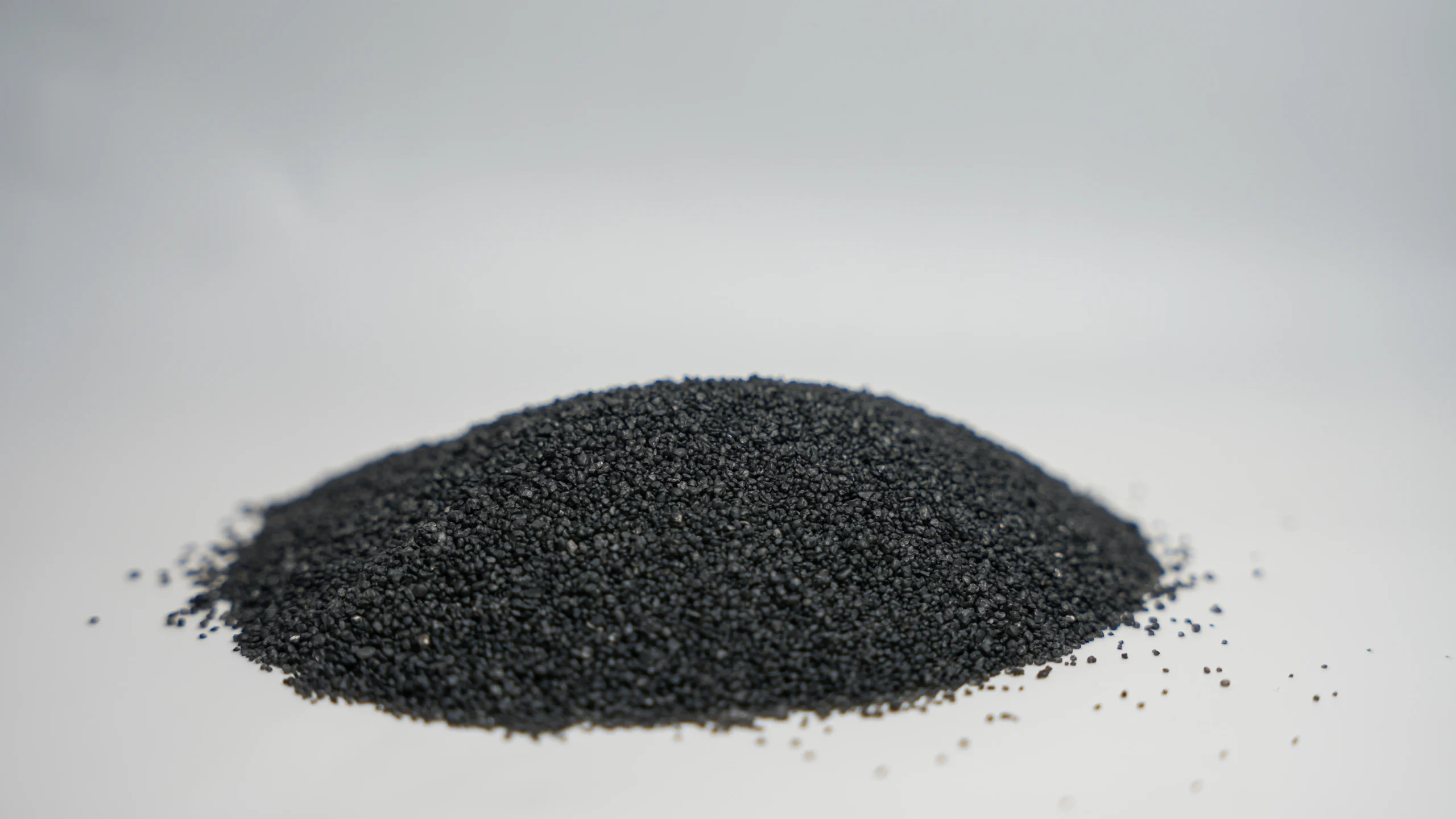 A small mound of black sand