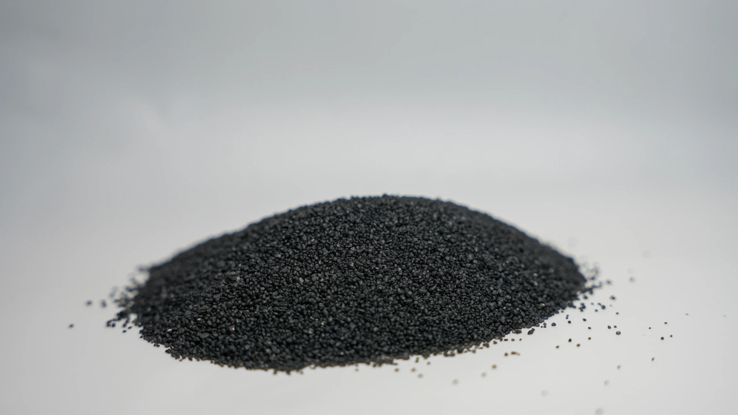 A small mound of black sand