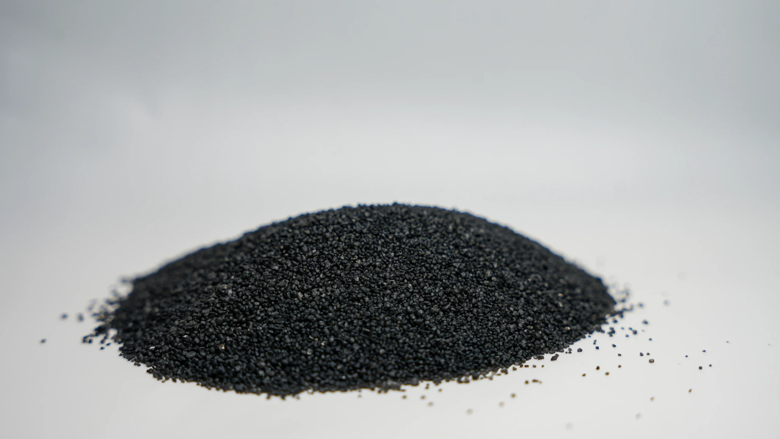 A small mound of black sand
