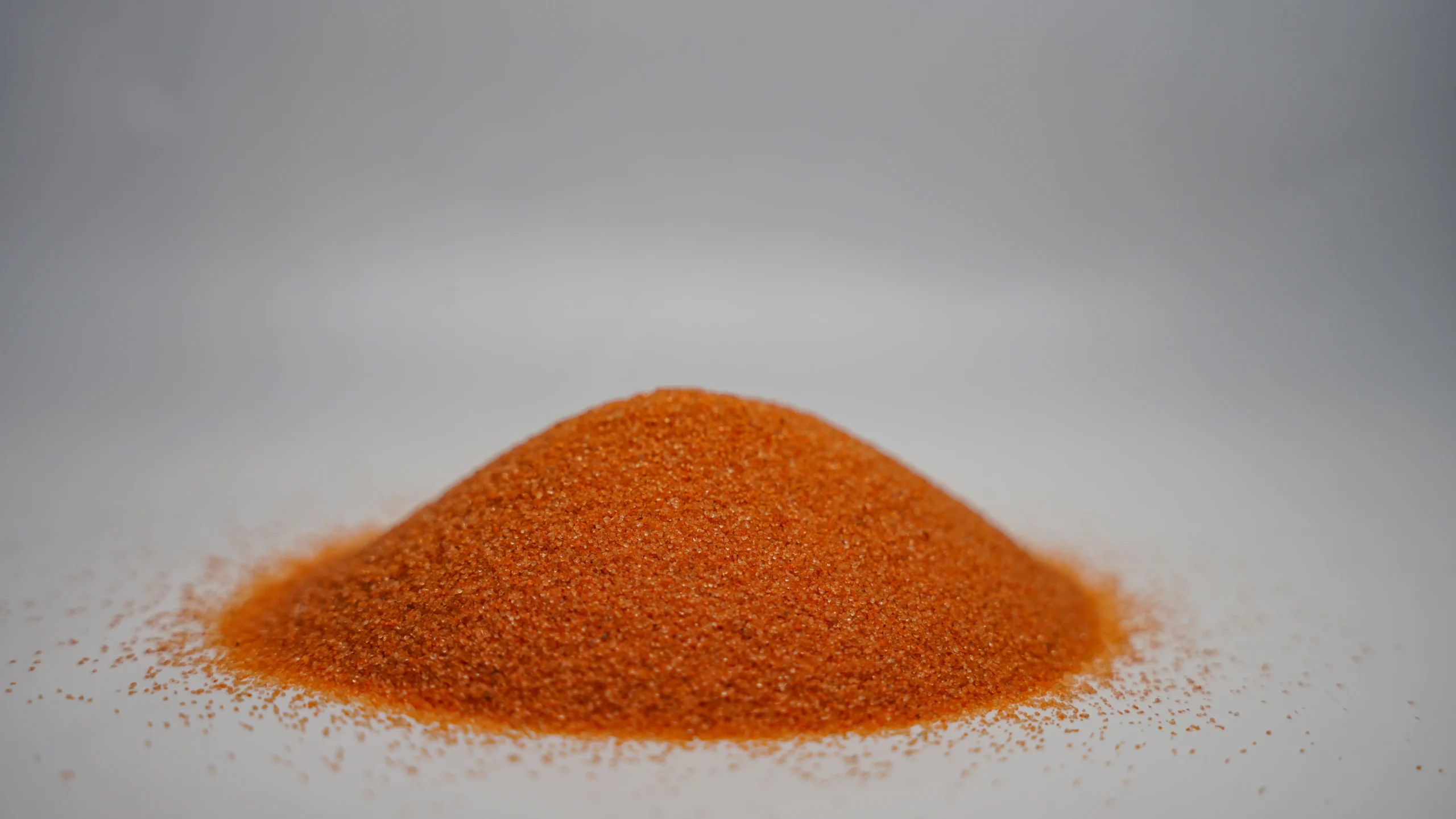 A small mound of fine orange sand