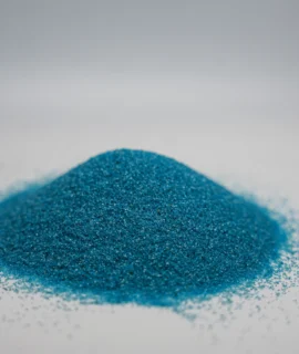 A small mound of fine sky blue sand