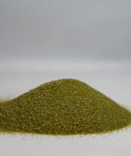 A small mound of fine green abrasive sand